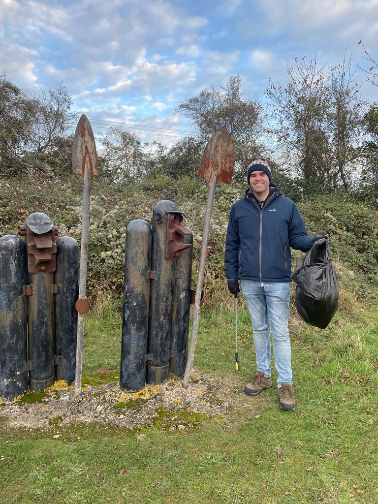 Sean picking up litter