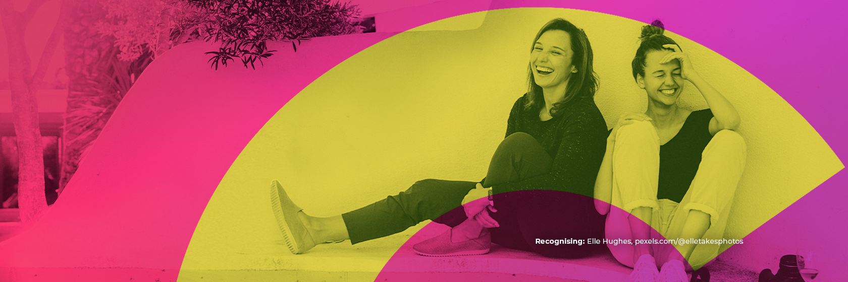 Hero banner showing 2 women sitting and laughing